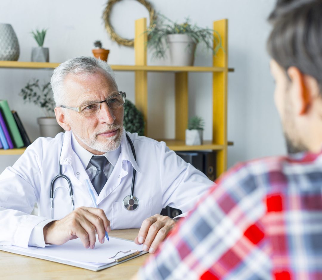 bearded-doctor-listening-patient